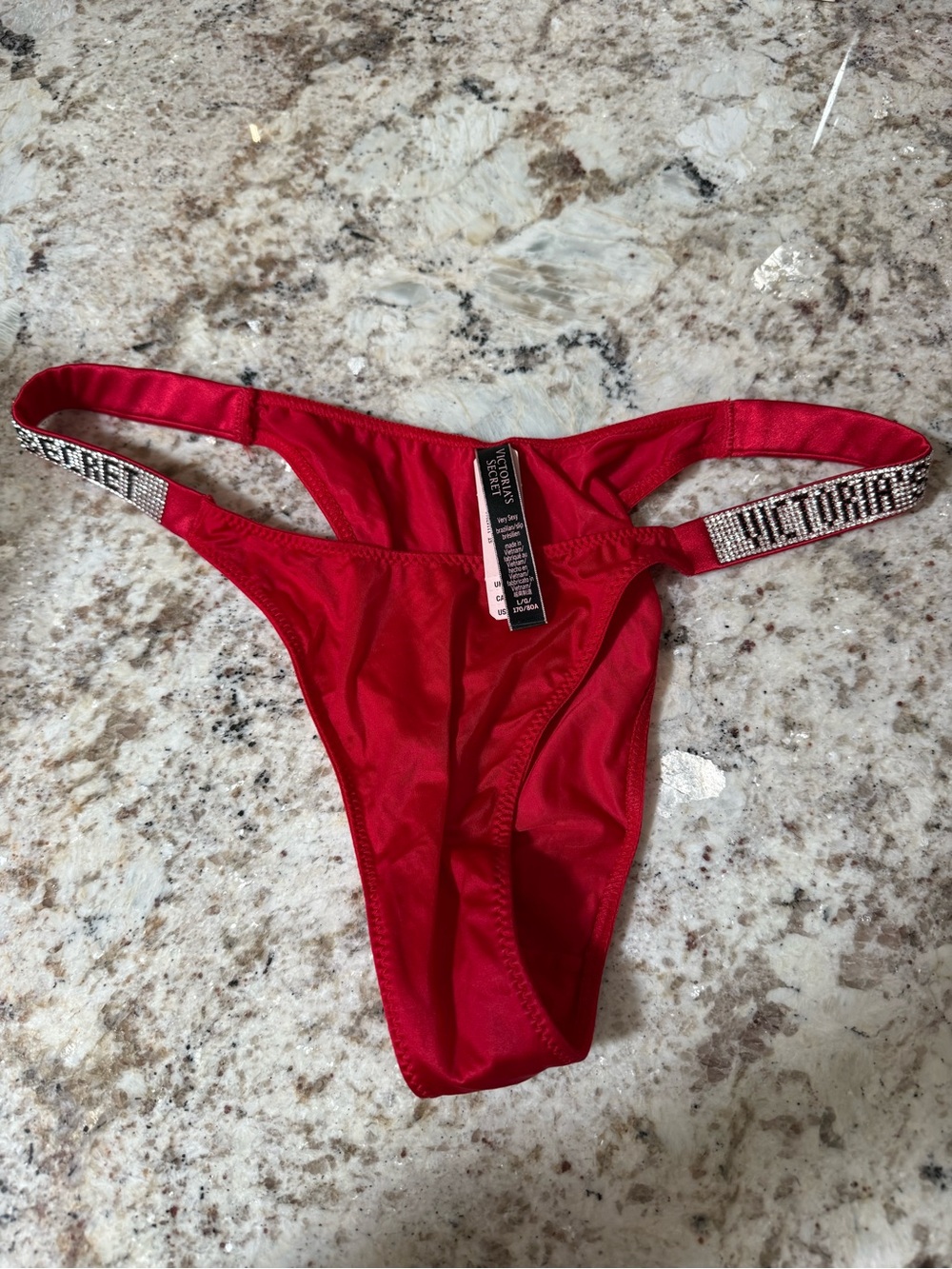 Red Victoria secret thong rhinestone detailing logo size large NWT